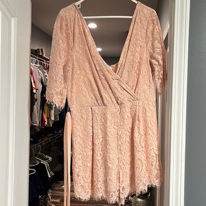 Lace romper with sash/tie.